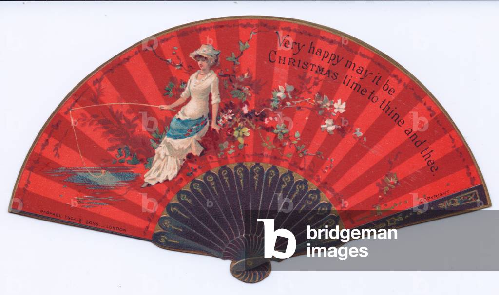 A Victorian die cut Christmas card in the shape of a fan with an image of a woman fishing at a pond, c.1880 (colour litho)