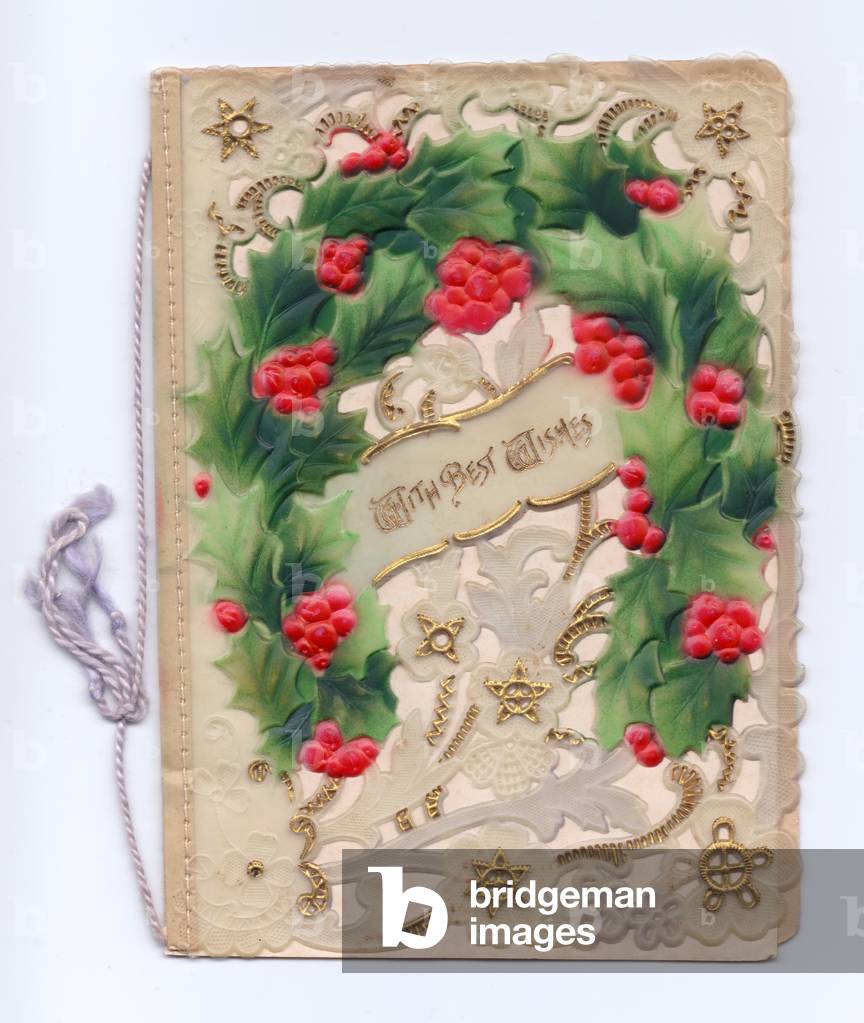 A Christmas card made of plastic with an embossed holly horseshoe, circa 1910 (plastic)