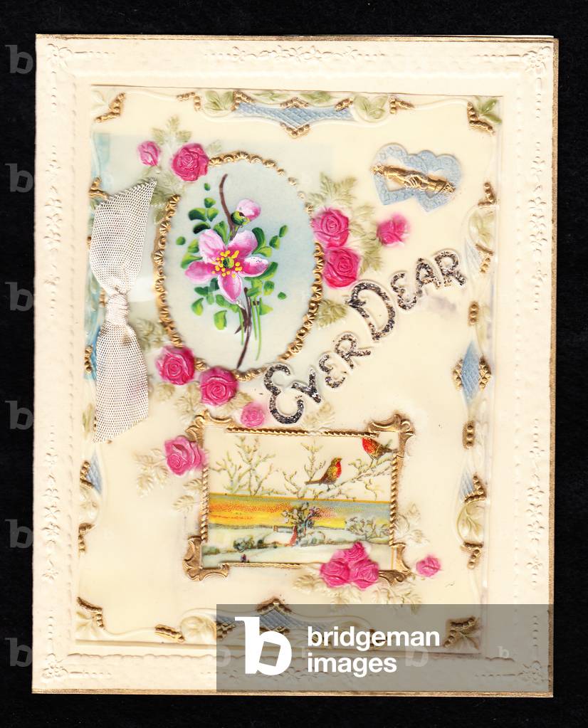 A greeting card made of plastic and depicting hand-painted roses and robins, circa 1910 (plastic)