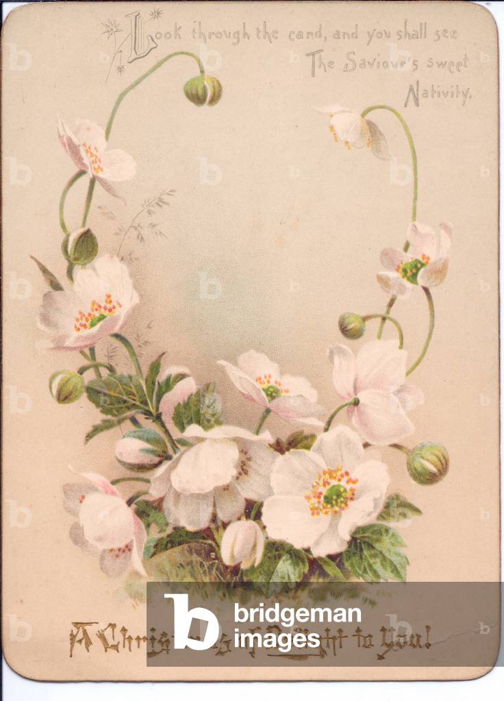 A Victorian hold-to-light Christmas Card. When the card is held in front of a light source a nativity scene appears, circa 1890 (coloured lithograph)