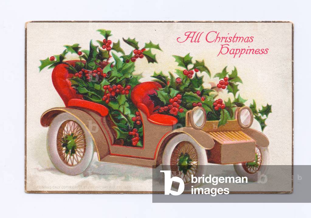 Edwardian Christmas postcard of a vintage car filled with holly, c.1910 (colour litho)