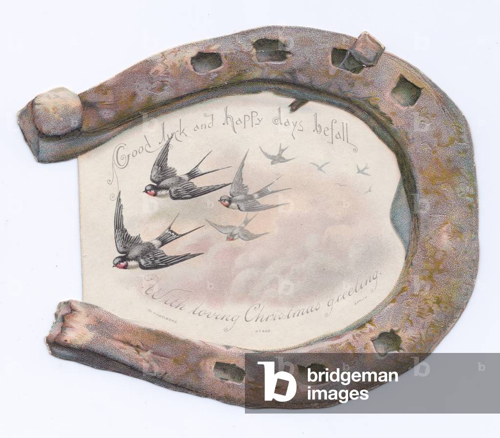 A Victorian Die-cut Shape Christmas card of an image of birds flying framed by a rusty horseshoe, c.1880 (colour litho)
