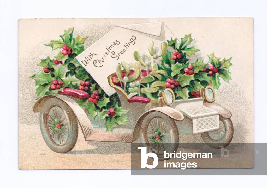 Edwardian Christmas postcard of a vintage car filled with holly, c.1910 (colour litho)