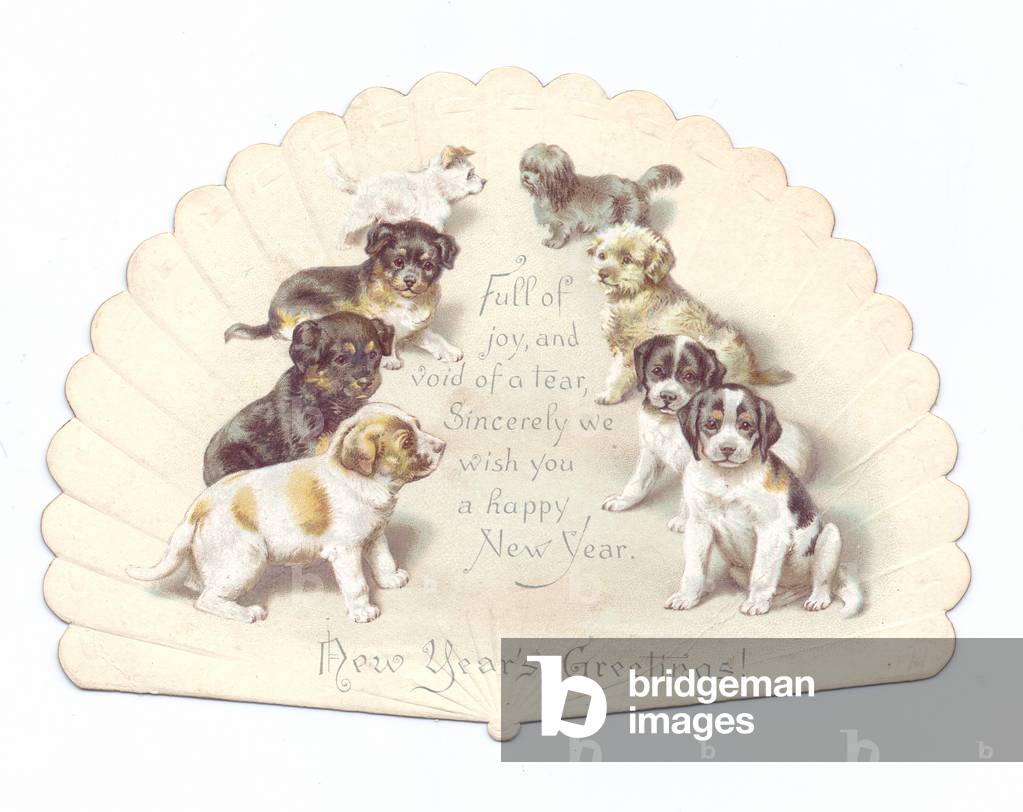 A Victorian Die-cut shape New Year card of a fan with images of puppies on it, c.1880 (colour litho)