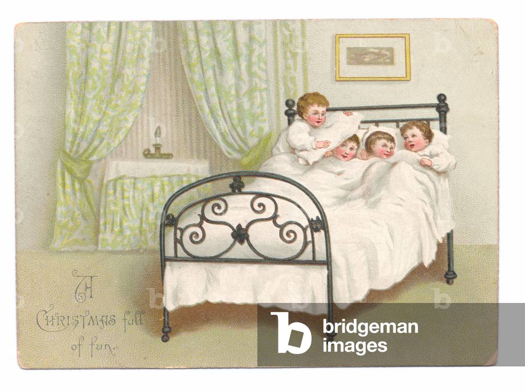 A Victorian Christmas card of four boys snuggling in bed, c.1880 (colour litho)