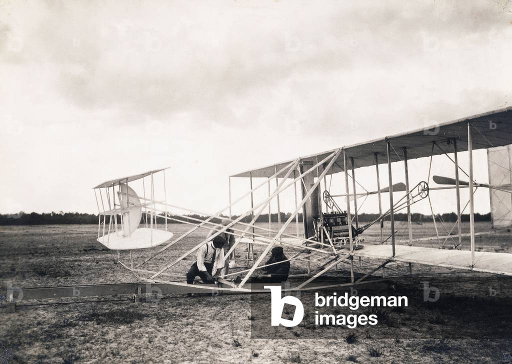 Leon Bollee working on the Wright brothers' plane, c.1909 (gelatin silver print)
