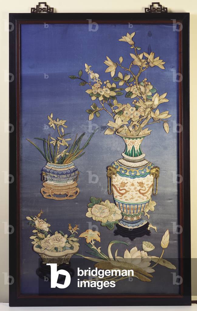 A silk panel depicting vases with cherry blossoms, magnolia and orchids and a jardinere with roses amid sprigs of lotus, day lilies and morning glories (silk applique)