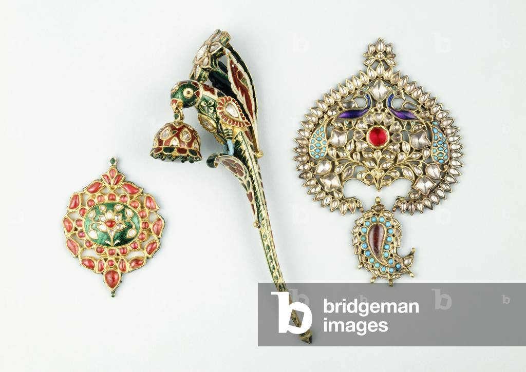 A gold turban pin in the form of a parrot; a pendant with a floral design; and a double pendant with a floral design and two peacocks, 19th century (enamelled gold, jewels)