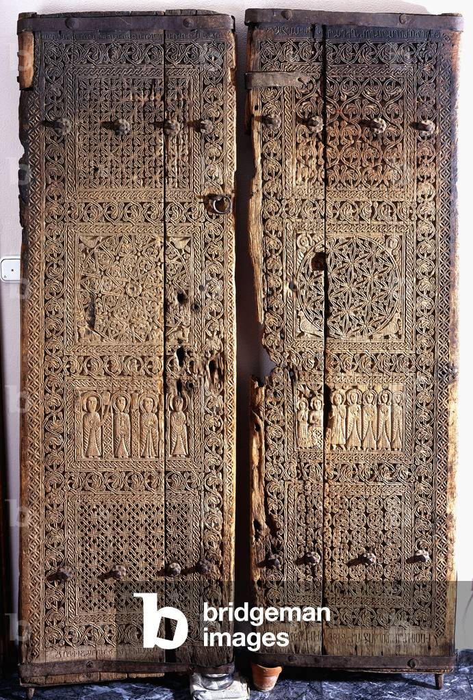 A pair of carved Armenian walnut doors, depicting Christ with six Apostles and Saints, 1312 (walnut wood)
