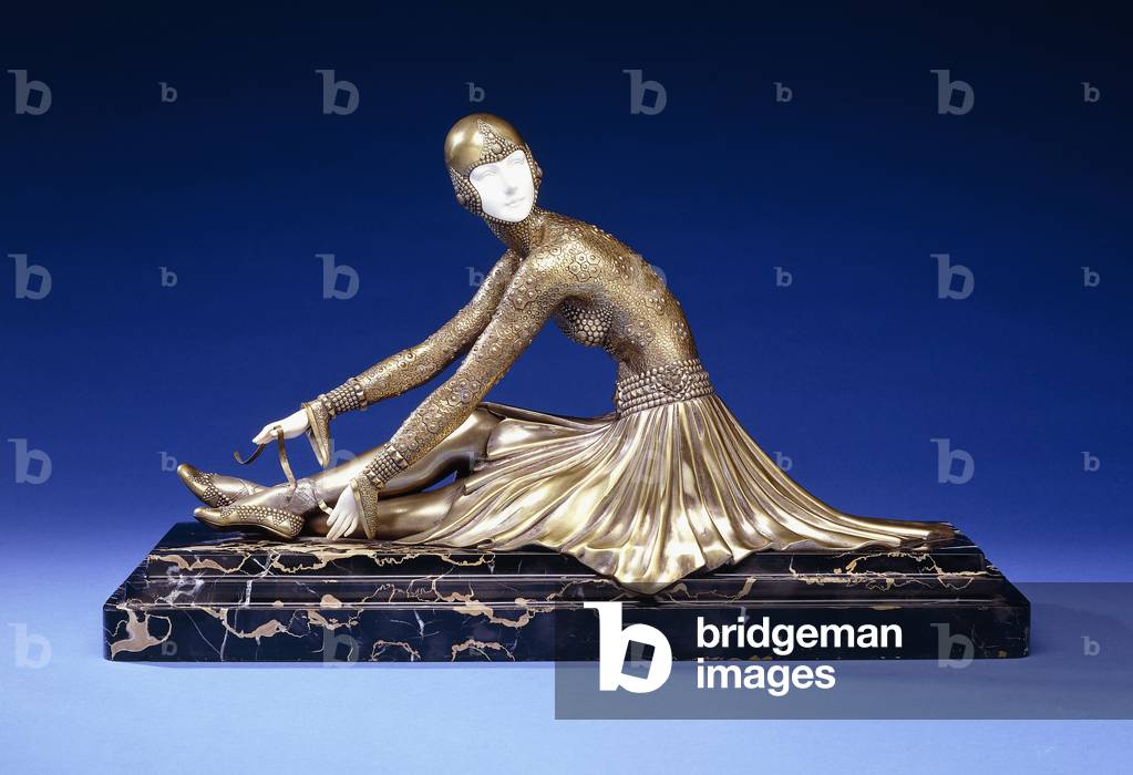 Tamara, a Figure of a Ballerina Tying her Shoe, early 20th century (gilt-bronze, silvered, ivory, veined black marble base)