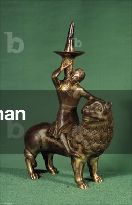 Pricket candlestick, in form of a lion being ridden by a man, Nepalese, 16th century