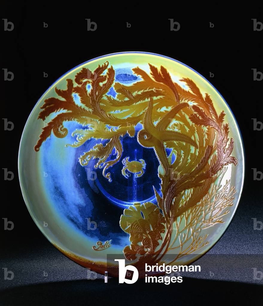 A Galle 'Sousmarin' martele and double overlaid platter, decorated with a crab and star-fish amidst sea foliage,  (glass, polychrome enamel)