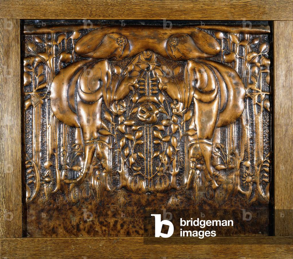 A decorative lead panel moulded in high relief, depicting two facing stylised maidens, 1902 (lead, lacquered finish, oak frame)