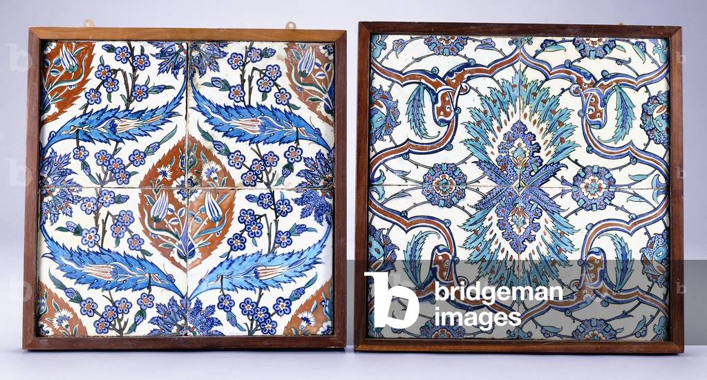 An Iznik tile with plum blossoms and tulips, made circa 1570, and a 17th century Iznik tile with red and blue split palmette, c.1570 ; 17th century (ceramic)