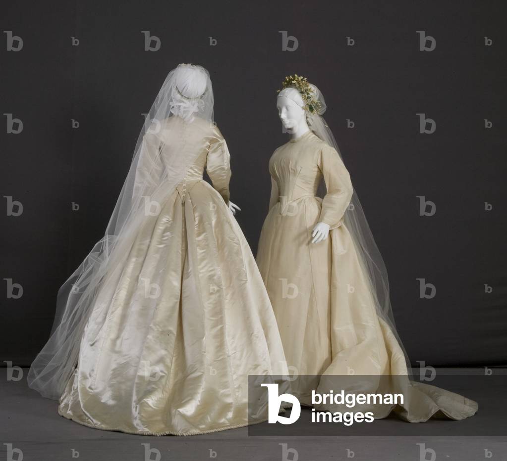 Wedding dresses, 1870 (silk and wool taffeta; maker unknown) and 1866 (silk satin, silk thread cord, silk lace; no label)
