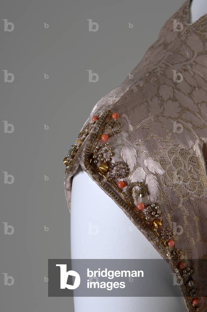 Evening dress, c.1938 (detail view of shoulder), Silk brocade, glass beads, and coral trim, Mainbocher, France