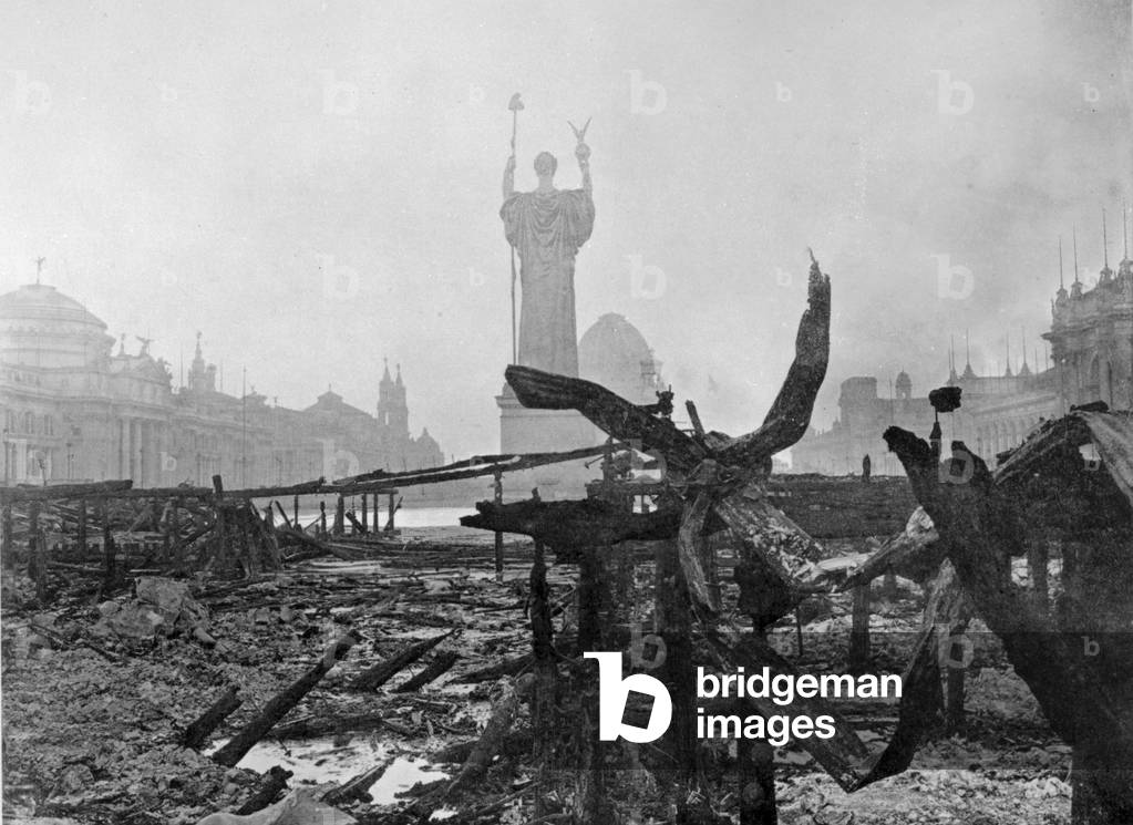 View of the Statue of the Republic amidst the ruins of the Court of Honor of the World's Columbian Building after a fire on January 8, 1894 (b/w photo)