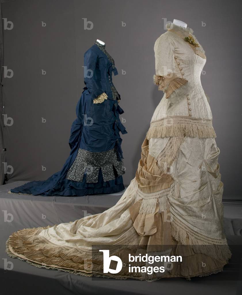 Wedding dress, 1877, Silk satin, silk jacquard, silk taffeta, silk fringe, silk lace, Field, Leiter & Co, Bridesmaid dress, 1879, Silk taffeta, brocade, lace, Maker unknown