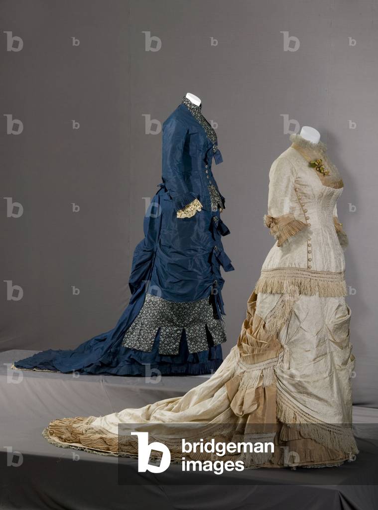 Wedding dress, 1877, Silk satin, silk jacquard, silk taffeta, silk fringe, silk lace, Field, Leiter & Co, Bridesmaid dress, 1879, Silk taffeta, brocade, lace, Maker unknown