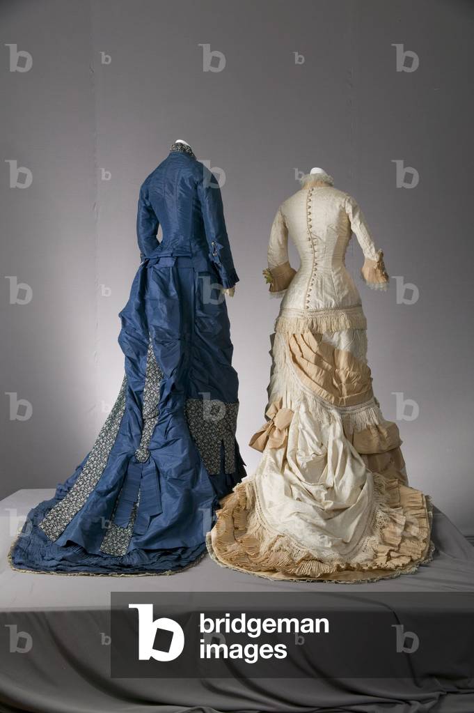 Wedding dress, 1877 (back view), Silk satin, silk jacquard, silk taffeta, silk fringe, silk lace, Field, Leiter & Co, Bridesmaid dress, 1879, Silk taffeta, brocade, lace, Maker unknown