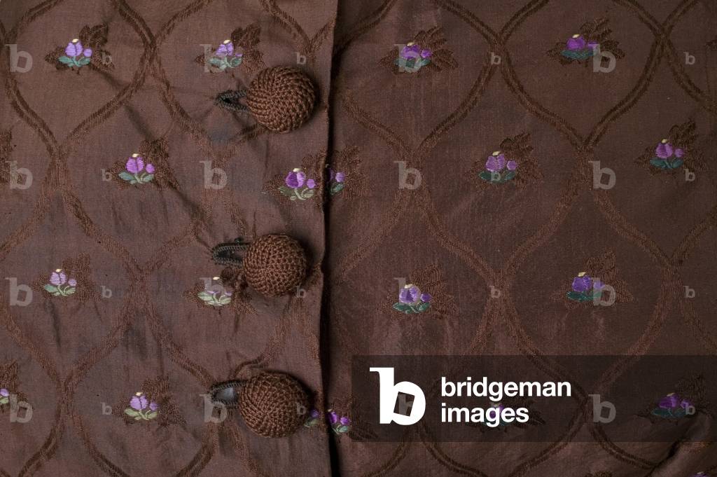 Wedding dress, 1863 (detail view of front button closure), Silk brocade, lace, glass beads, Maker unknown