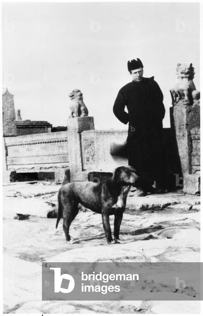 Father Pierre Teilhard de Chardin (1881-1955) on a bridge of the imperial road at Shiensien, China, c.1924 (b/w photo)