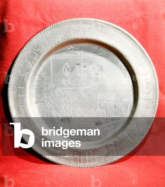 Plate from the Alsace region depicting a Jewish family at a festival meal (pewter)