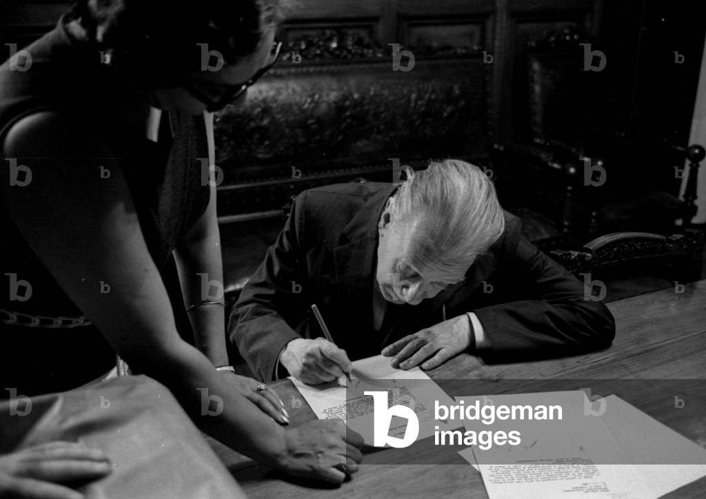 Jorge Luis Borges at the Biblioteca Nacional old headquarters (Mexico 562, Buenos Aires) where he was director, 1971 (b/w photo)