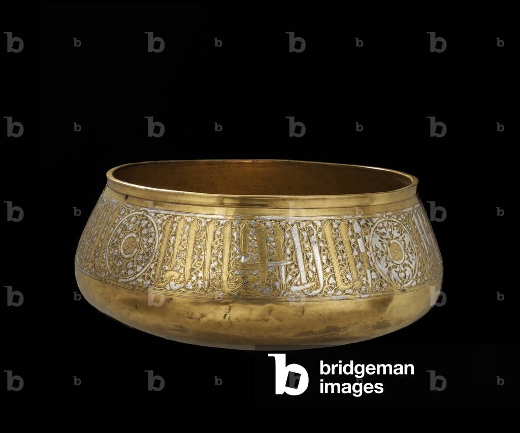 Bowl decorated with inscriptions of titles interspersed with roundels containing alternately birds and interlaced plants with central whirling rosettes, 1300/1330-c.1360 (metalworked engraved brass & silver inlay)