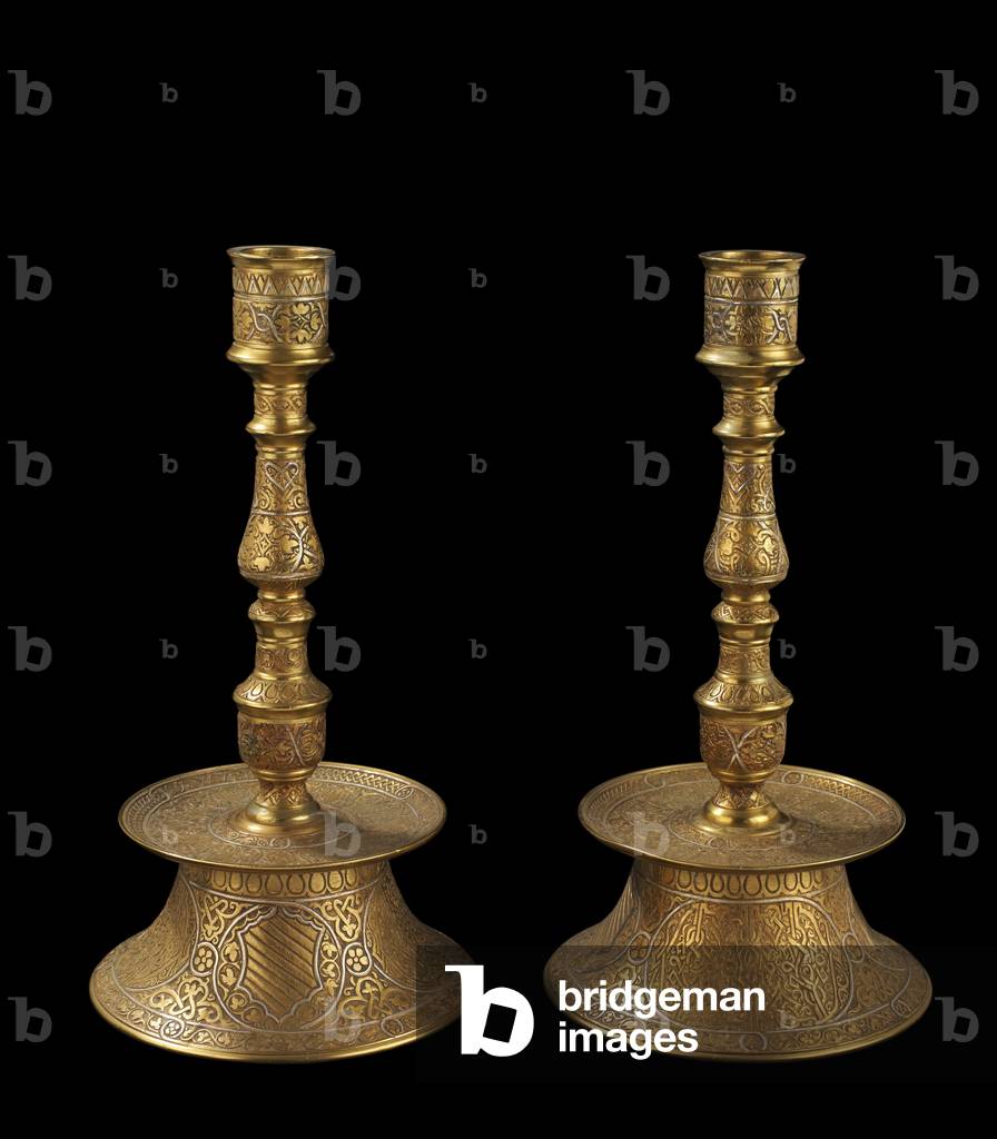 Pair of candlesticks, each with a coat of arms and a blank shield, 19th century (cast bronze with silver overlay)