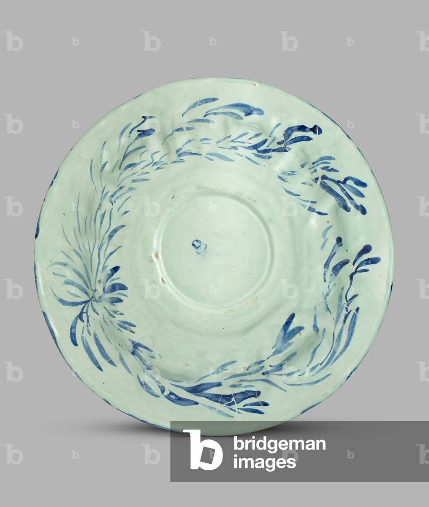 Large moulded dish with Harpy border decorated in blue with 
double coat-of-arms in centre flanked by putti and surmounted by 
a coronet and putto (one of a pair) , 1650-1725 (tin-glazed earthenware (maiolica))