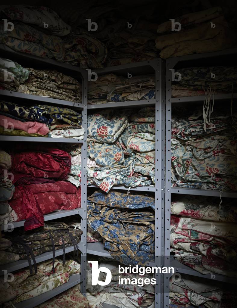 A storage room filled with piles of chintz case covers, early 1800s-1990s, Chatsworth House (photo)