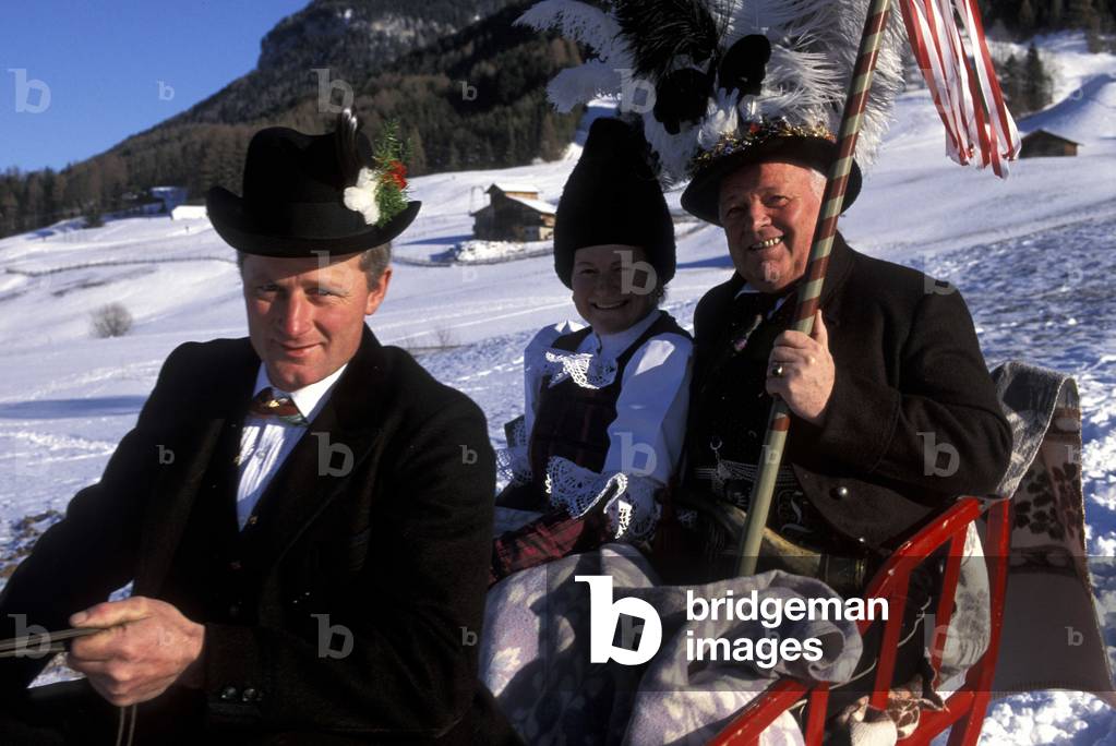 A peasant wedding, Master of ceremonies on a sleigh, Castelrotto, Trentino Alto Adige, Italy.