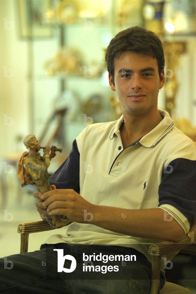 Savio Iermano with shepherd statue, Iermano Antiquities, Naples, Campania, Italy