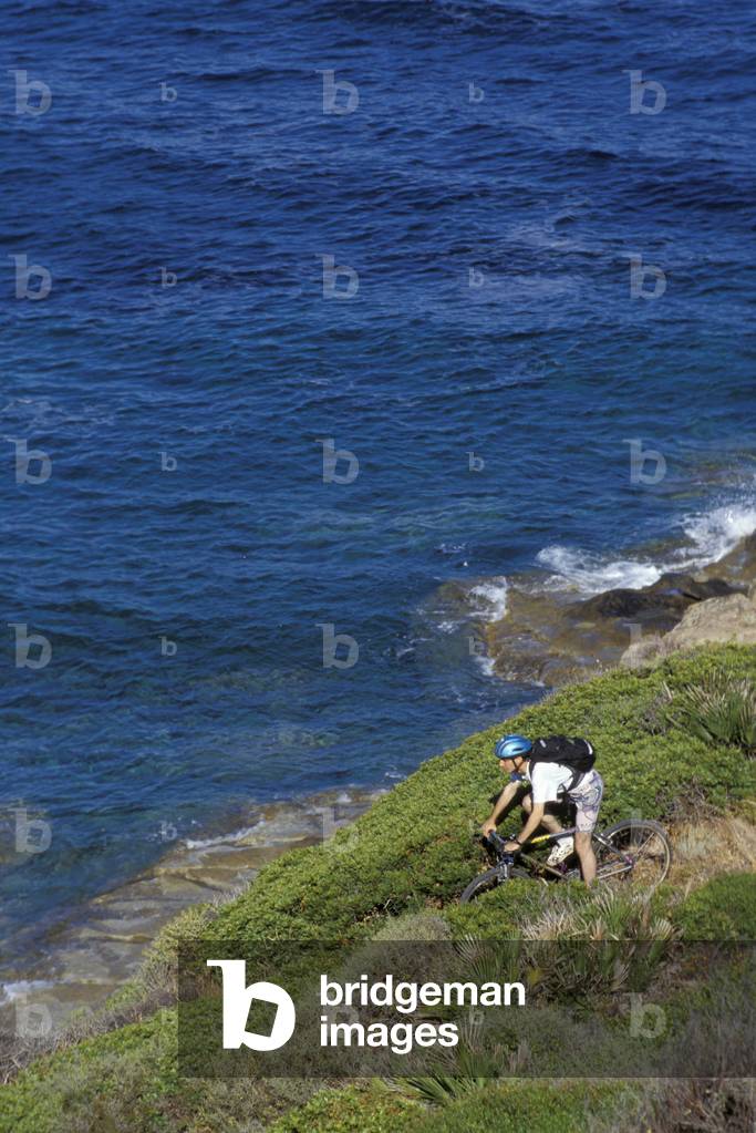 Cyclist on the clif, Biking around Italy