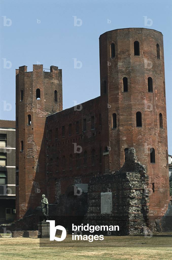 Statue in front of a gate, Palatine Gate, Turin, Piedmont, Italy