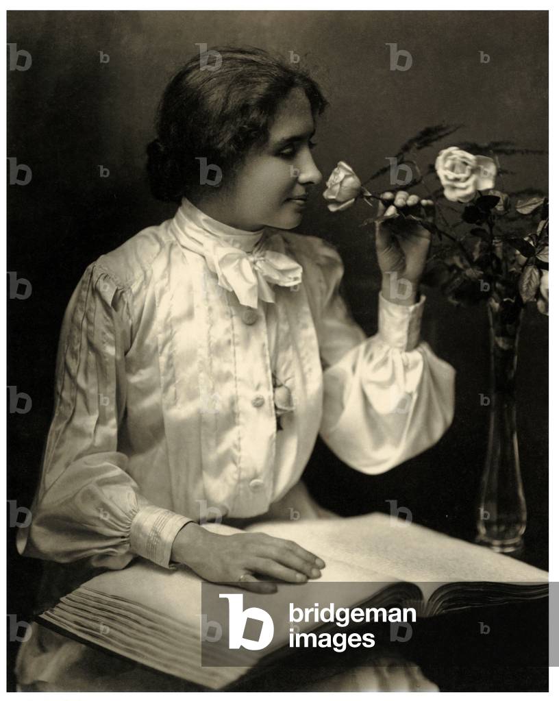 Portrait of Helen Keller smelling a rose.  c.1910  (b/w photo)