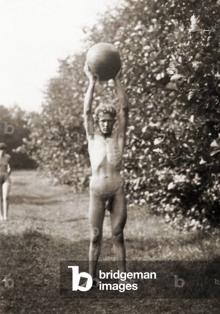 Young man exercising with a ball, Freikörperkultur, c.1930 (b/w photo)