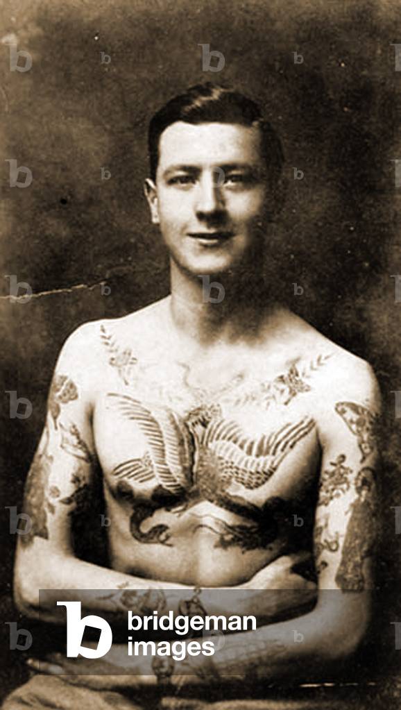 Portrait of a man with an elaborate tattoos c.1920 ( b/w photo )
