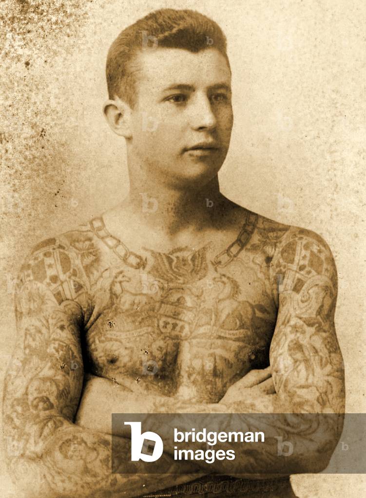 Portrait of a tattooed man (b/w photo)