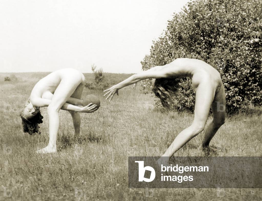 Naturists having fun playing with a ball, Freikörperkultur, c.1930 (b/w photo)