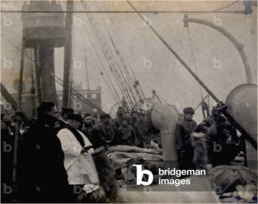 A priest praying over the victims of the Titanic,  1912 (photo)