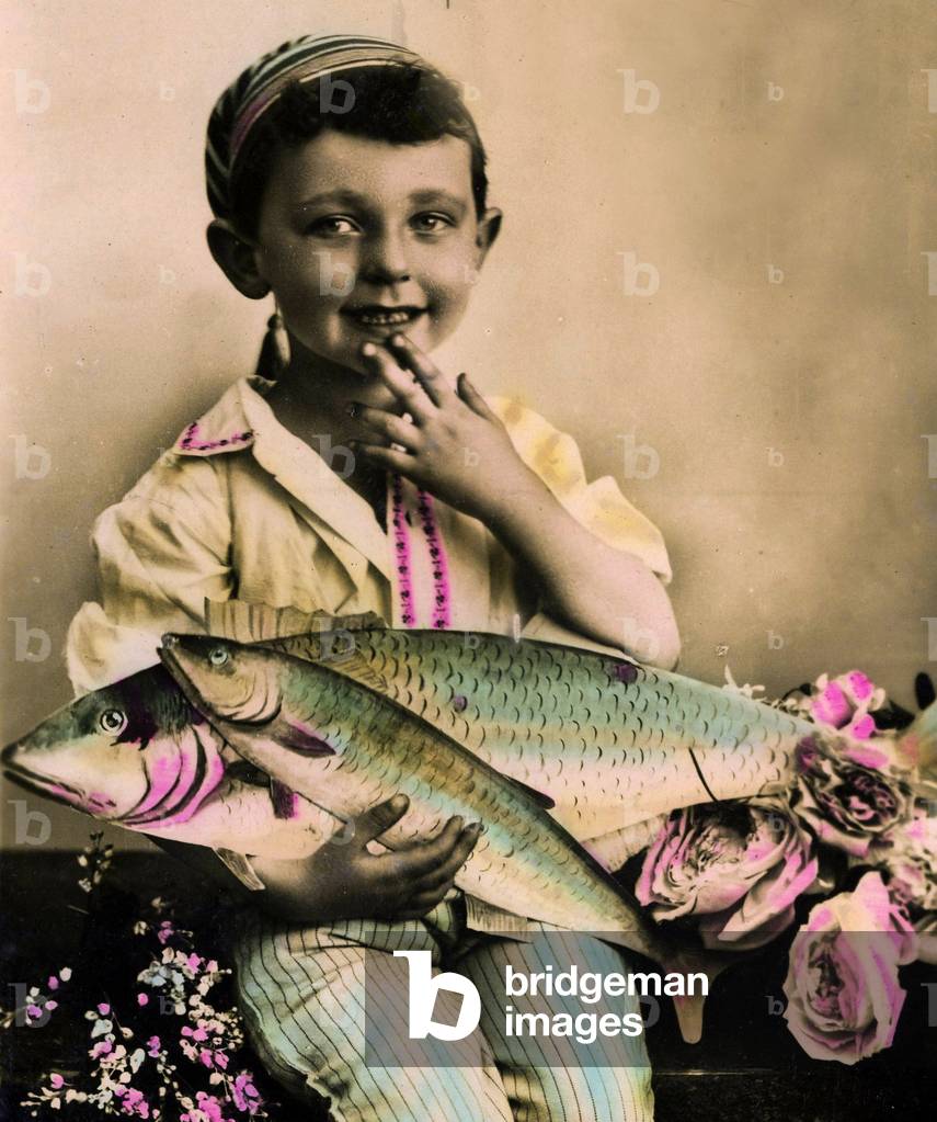 Portrait of a boy holding a fish  c.1898 (hand-tinted photo)