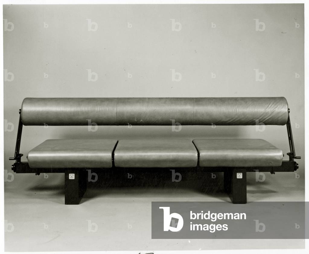 Bolster back sofa with metal frame (b/w photo)