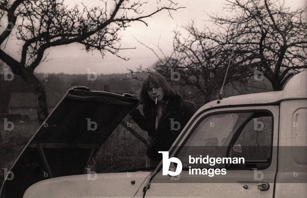 Actor Renaud on set on a movie, 1975 (b/w photo)