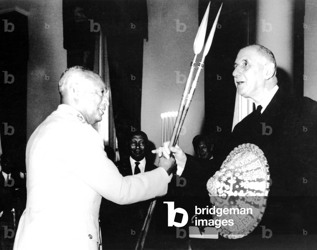 General de Gaulle receiving traditional Ethiopian lances and shield from Ras Mesfin, August 1966 (b/w photo)