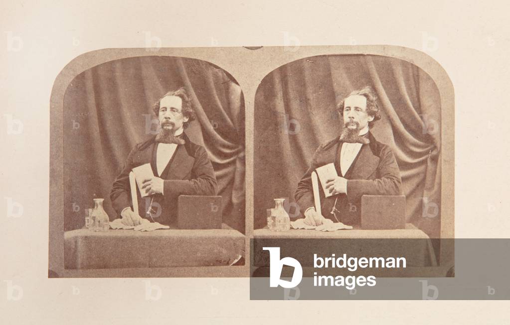 Stereograph of Charles Dickens posed as if reading, 1858 (b/w photo)