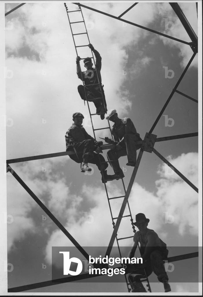 Workmen Sitting on Oil Derrick, 1935-36 (b/w photo)