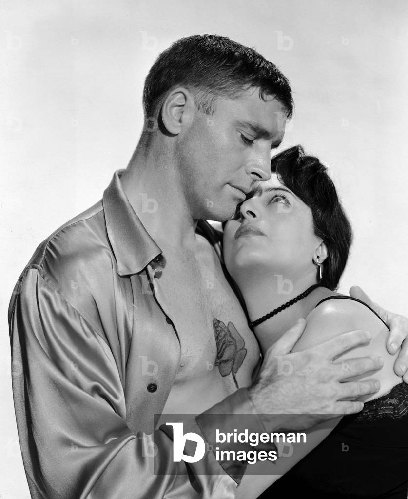 American Actor Burt Lancaster And Italian Actor Anna Magnani Embrace In A Promotional Portrait For The Film