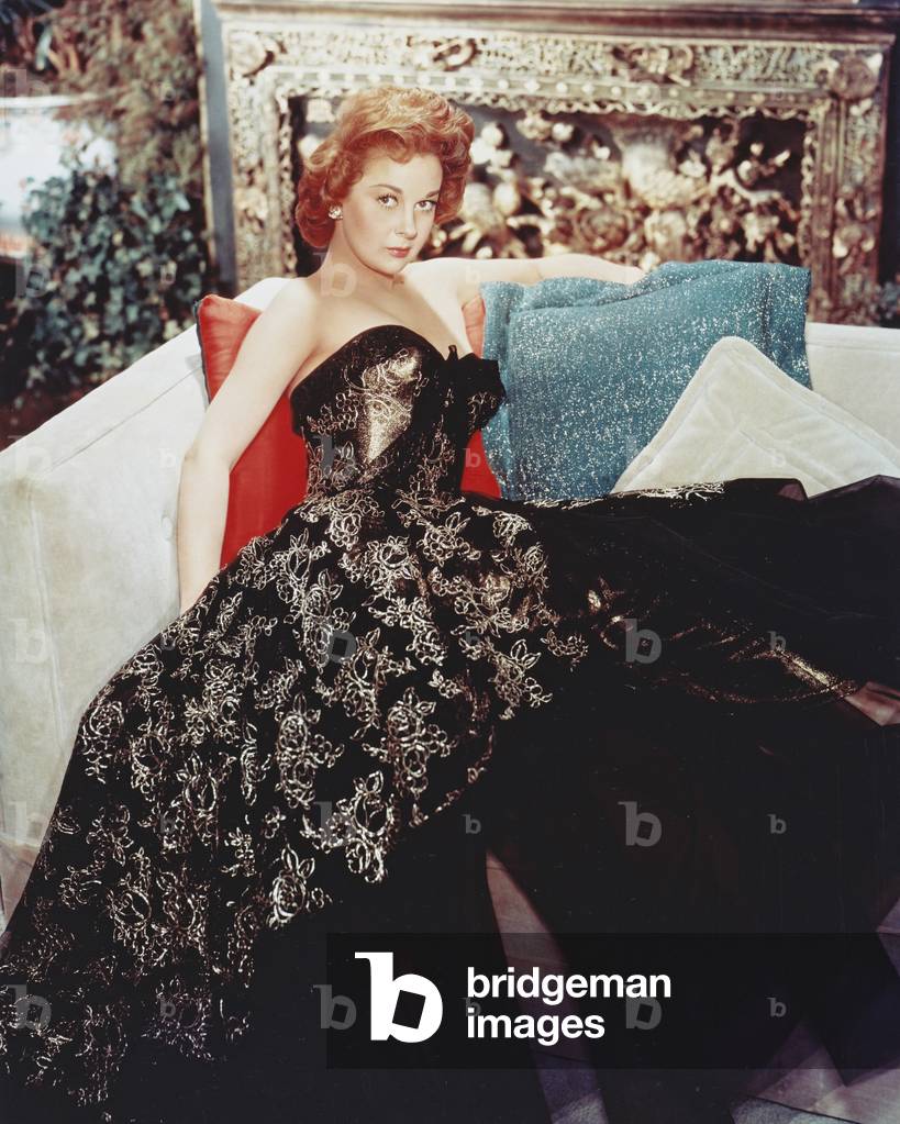 American Actress Susan Hayward (1918 - 1975) Wearing A Patterned Black Evening Dress, Circa 1950.